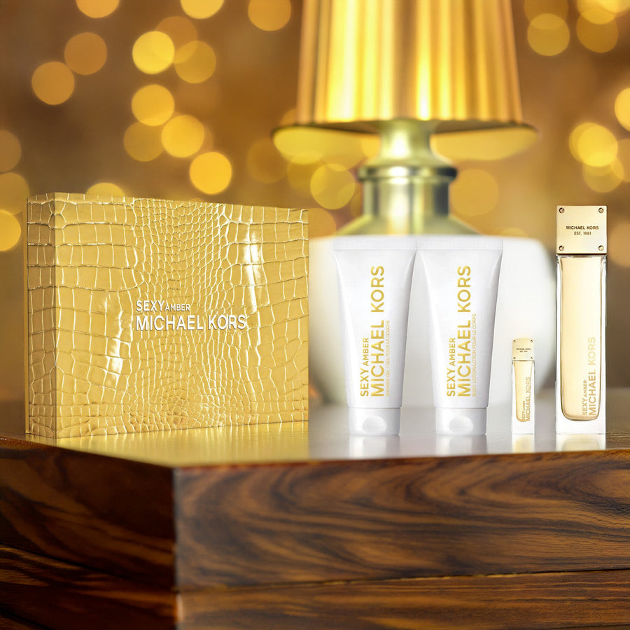 Michael Kors Sexy Amber 4 Pcs Set For Women: 3.4 Eau De Parfum Spray + 3.4 Shower Gel + 3.4 Body Lotion + 0.17 Eau De Parfum