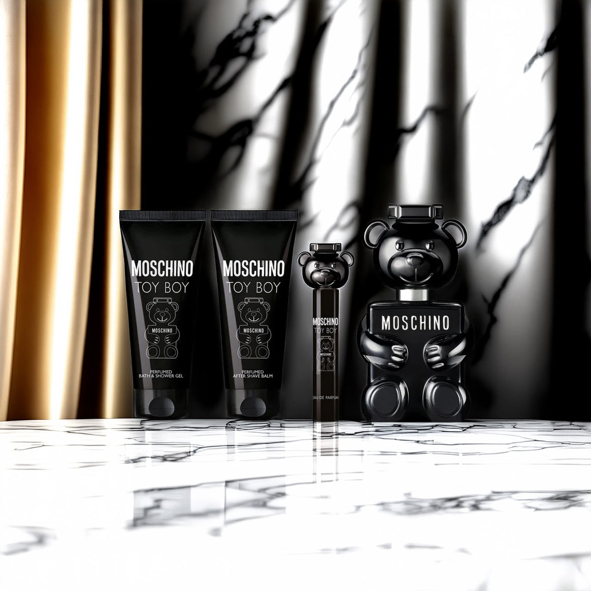 Moschino Toy Boy 2 4 Piece Set: 3.4 oz Eau de Parfum + 0.34 oz Eau de Parfum + 3.4 oz After Shave Balm + 3.4 oz Bath & Shower Gel For Men