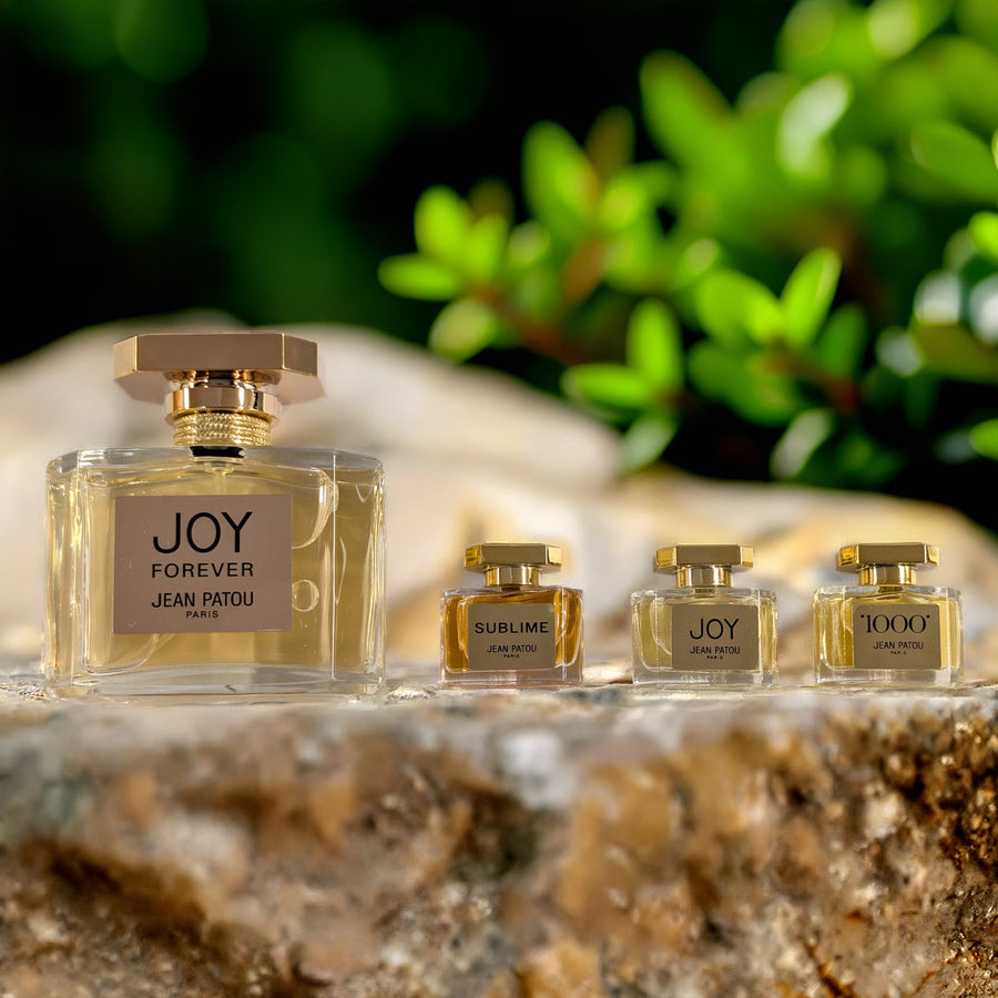 Jean Patou 4 Pcs Set: Joy Forever 2.5 Eau De Parfum Spray + 1000 5 ML Eau De Parfum Mini + Joy 5 ML Eau De Parfum Mini + Sublime 5 ML Eau De Parfum Mini